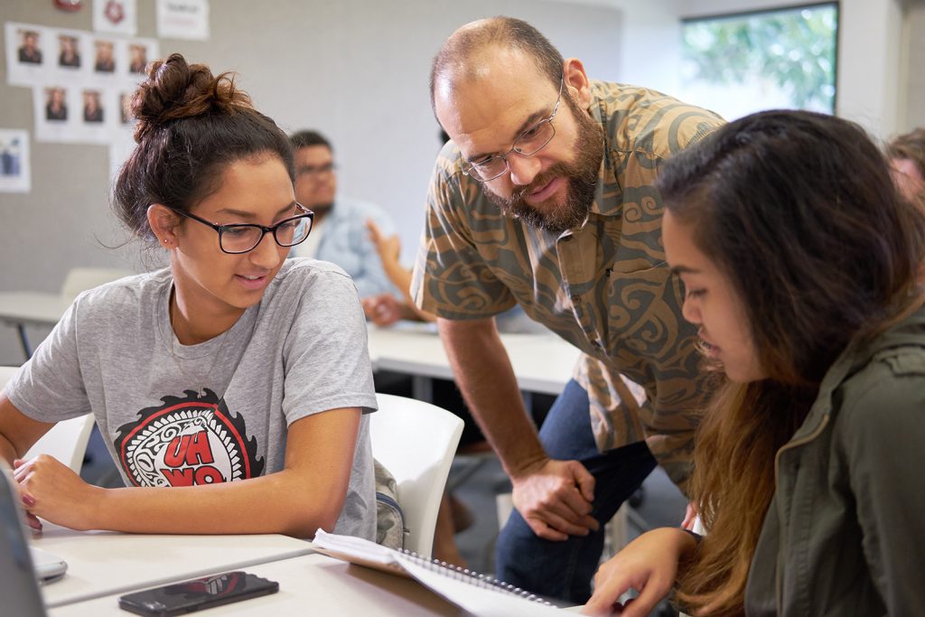 Professor interacting with students in class.