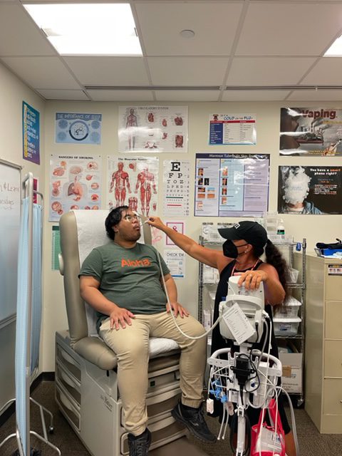 Student getting their mouth check in nurse's office