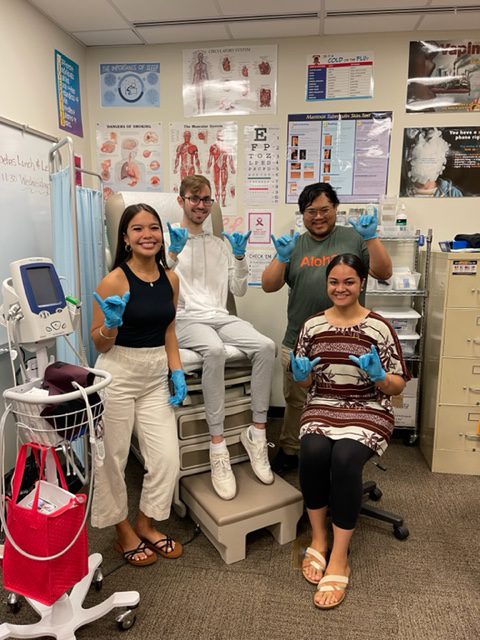 Students Shakaing in the nurse's office