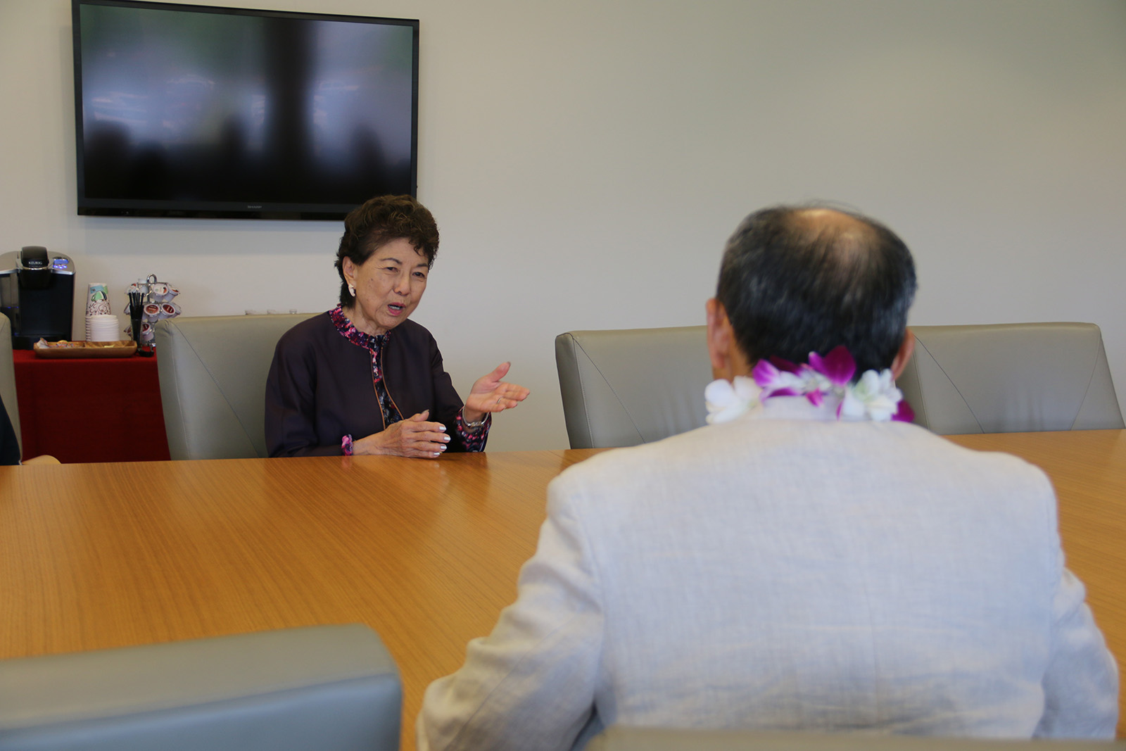 Dr. Doris Ching, UHWO VCAA speaking with Yosuchi Misawa, Consul General