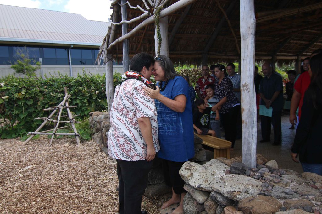 UH West Oʻahu Director of Indigenous Studies Manulani Meyer greets Vice Chancellor for Academic Affairs Jeffrey Moniz at the wehe on June 7. 