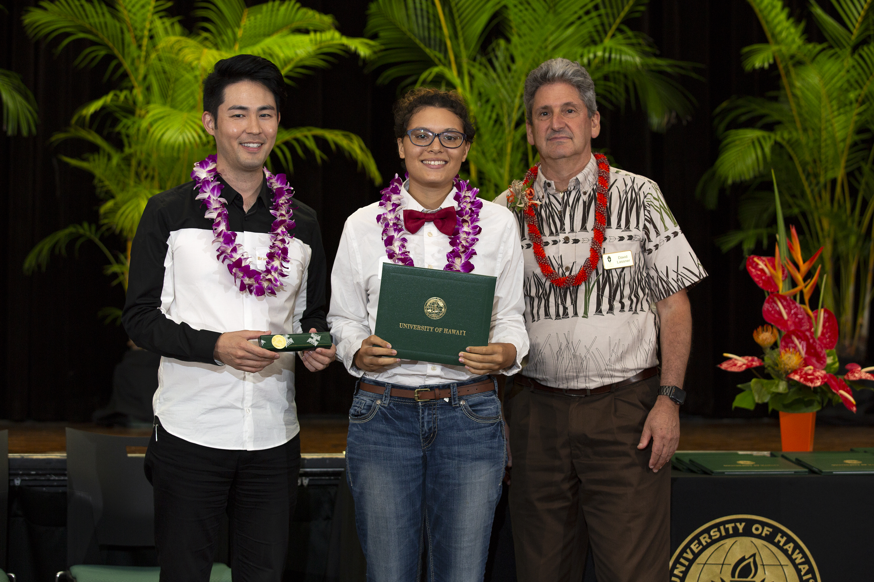 Emma Lake (center) and other Regent Scholars were honored at a July 19 ceremony. Also on hand were Regent Brandon Marc Higa (left) and UH President David Lassner (Right)