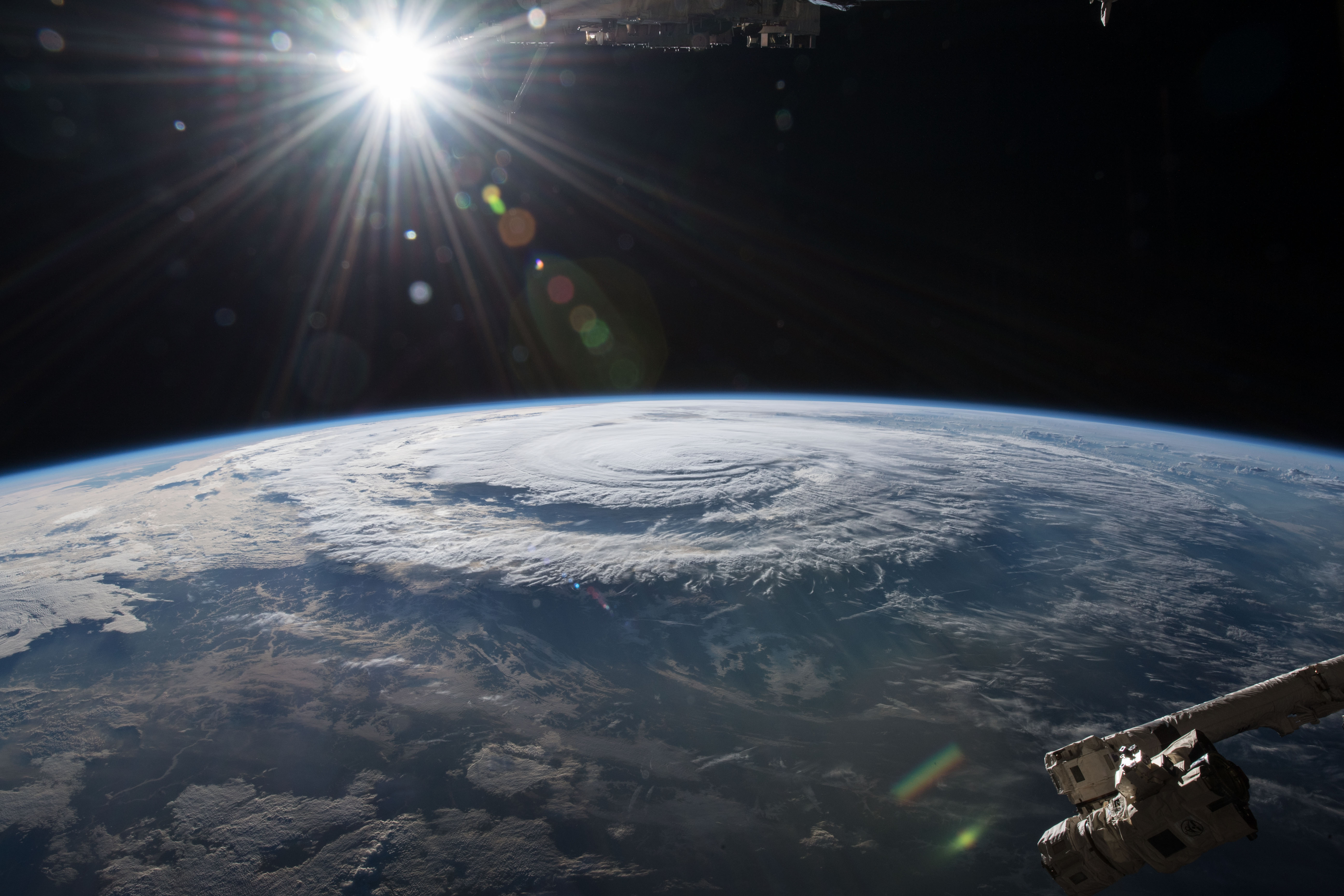 Photo of Hurricane Florence shot from space with sun shinning in distance
