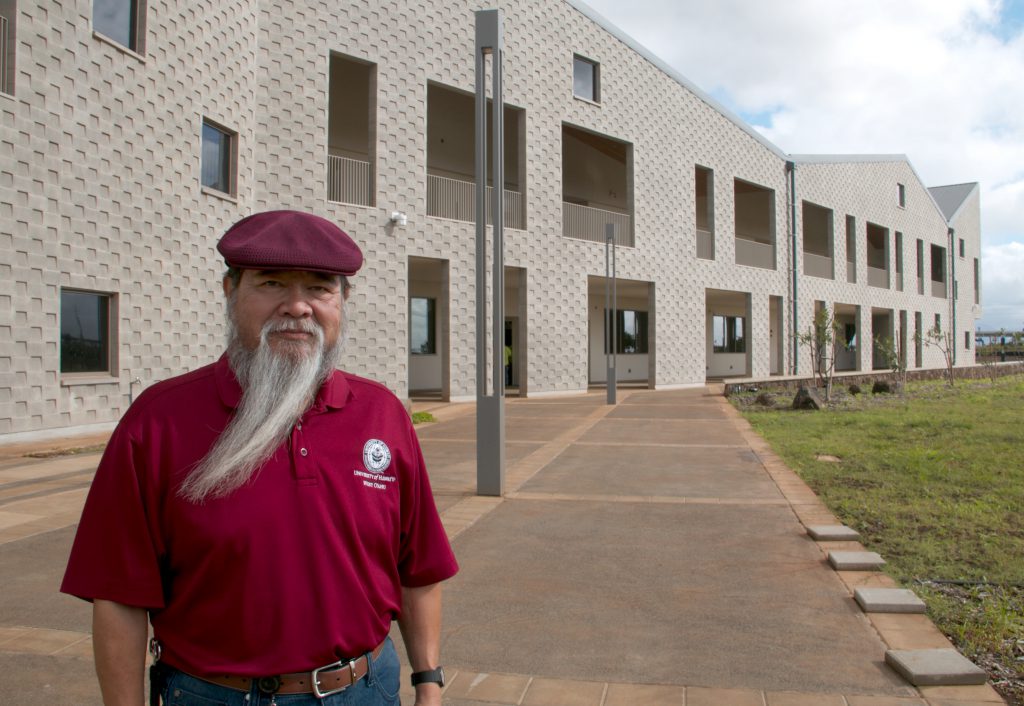 Photo of Dr. Ricardo Custodio standing in front of the new building