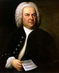 Painting of Johann Sebastian Bach sitting down, looking stately in a dark coat and white shirt
