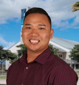 Photo of David Dinh in front of a green screen photo of UH West Oahu library tower