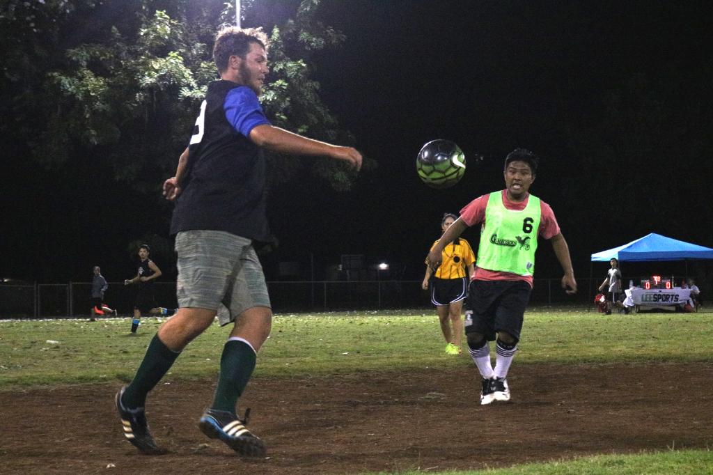 Soccer player receives the ball from a teammate