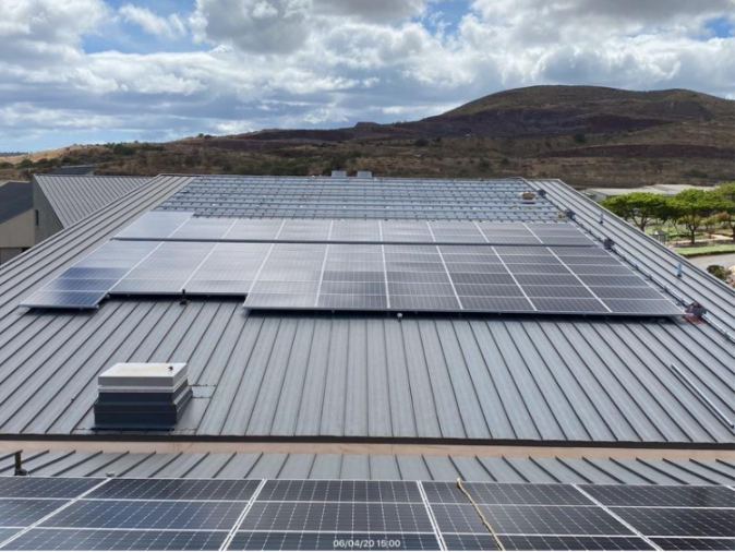 New photovoltaic panels installed on the roof of UH West Oʻahu’s Administration and Health Science Building.