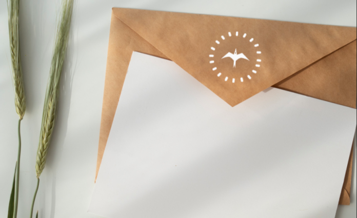 A blank sheet of paper and envelope.