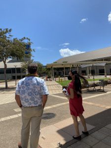 Congressman Ed Case (left) and Chancellor Maenette Benham stand in the campus upper courtyard.