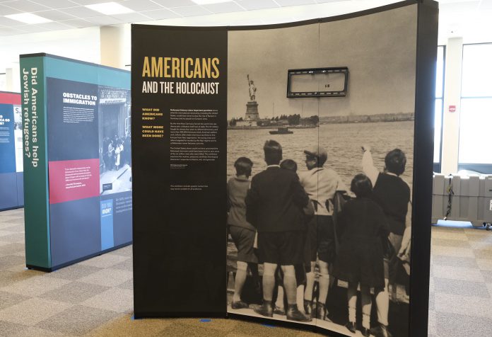 Vertical banners and photos of the Americans and the Holocaust exhibit.