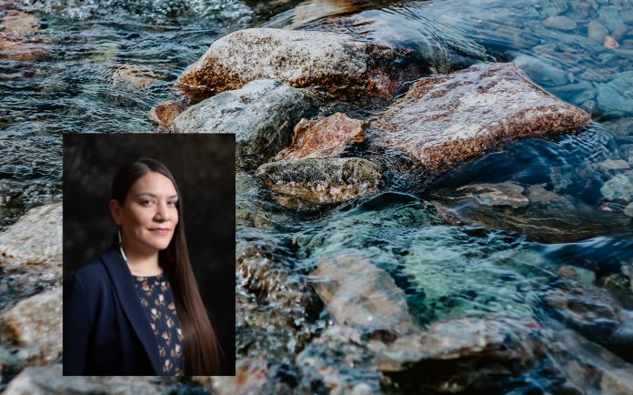 Close up of a body of water with rock and an inset photo of a woman.