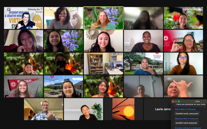 A Zoom screenshot with about two dozen participants smiling into their web cameras.