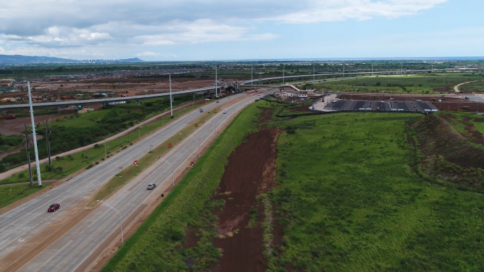 Aerial shot of Kualakai Parkway with U H West Oahu to the right of the photo.