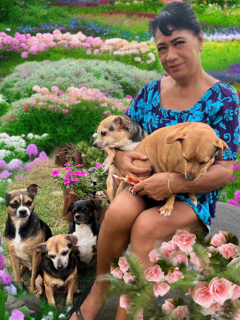 A woman with five dogs in a field of flowers.
