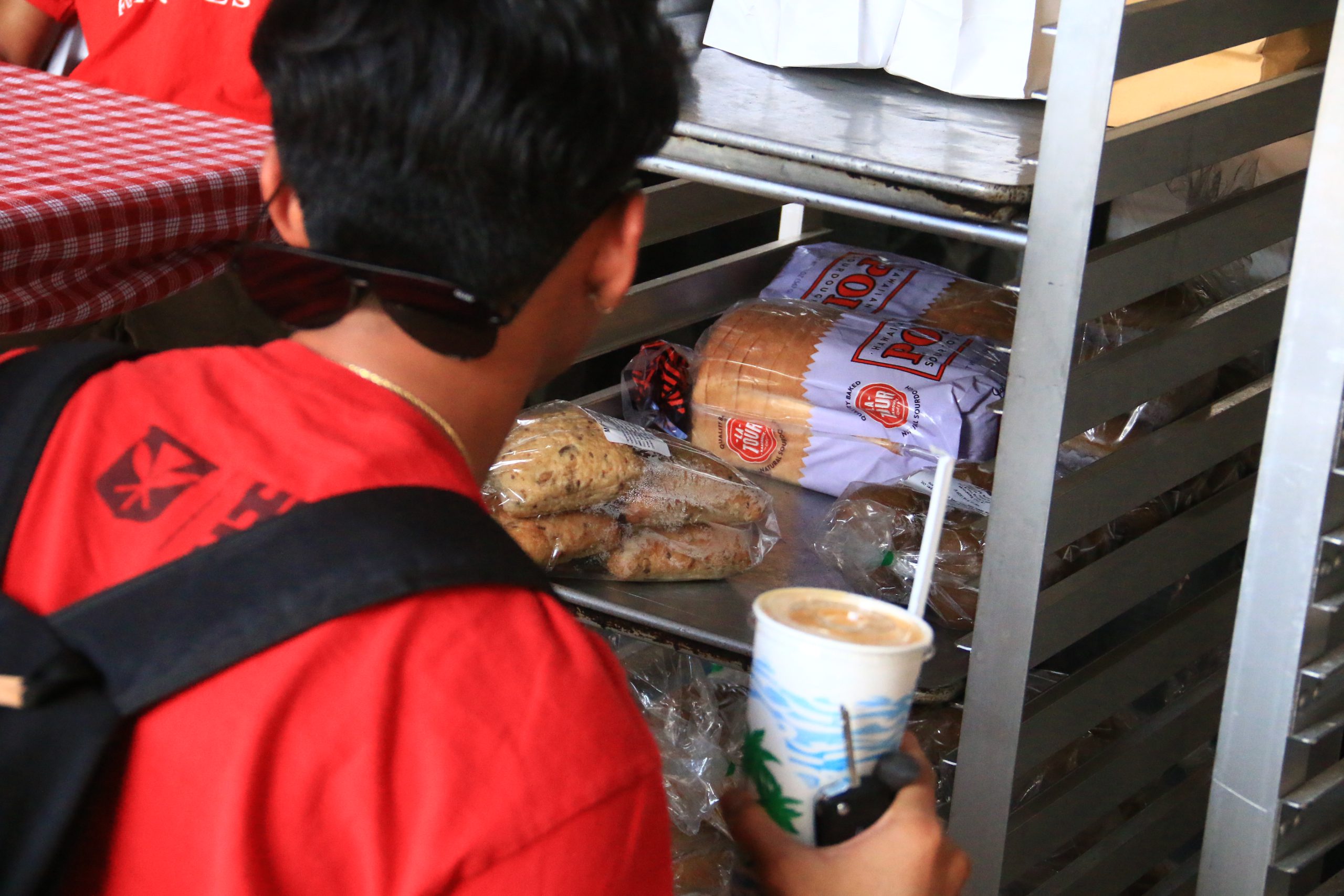 A student looks at a display of breads.