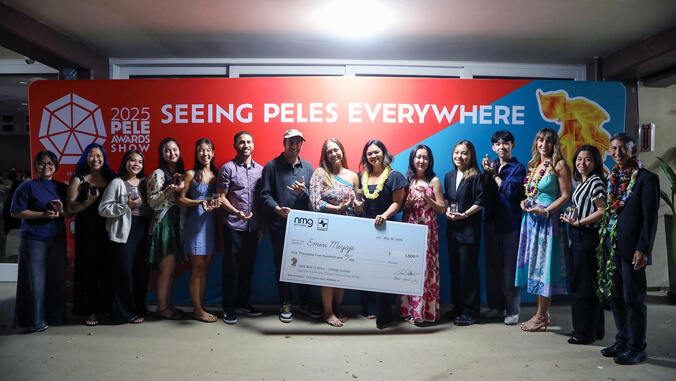 A group of people holding an oversized check.