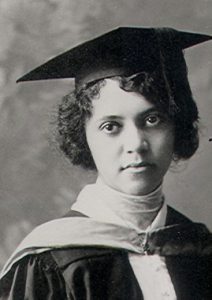 A black and white image of Alice Ball wearing a graduation gown and cap. 