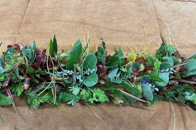 Closeup of a head lei with various plant material.