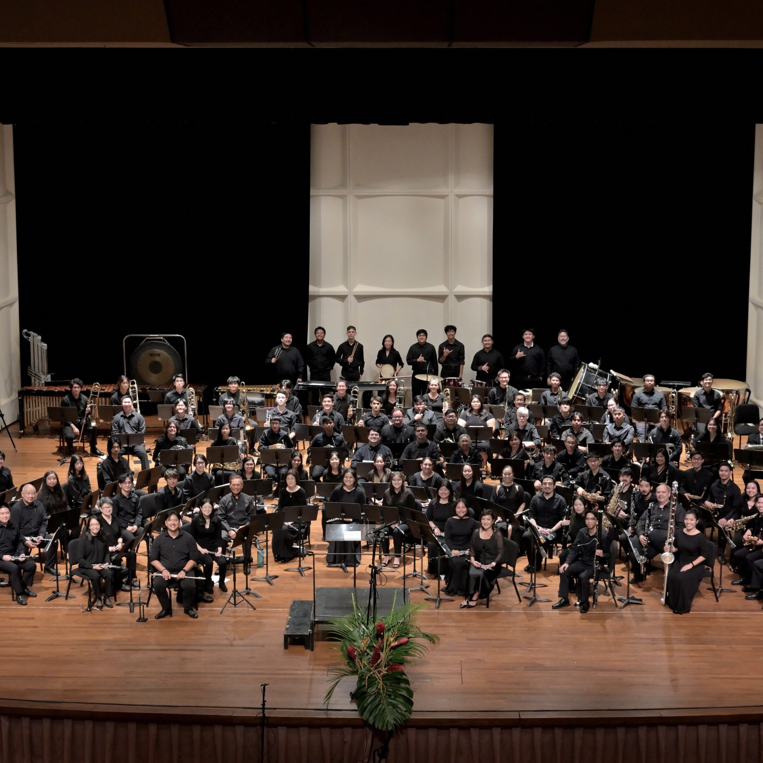 A full band on a concert stage.