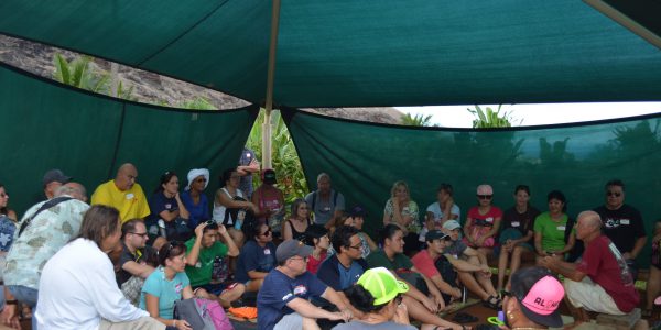 People gathered under a tent