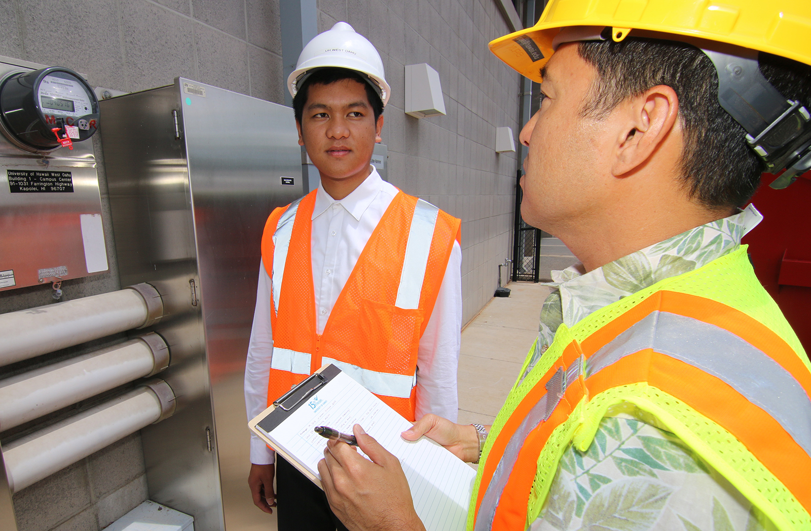 Facilities Management student getting instruction from a supervisor.