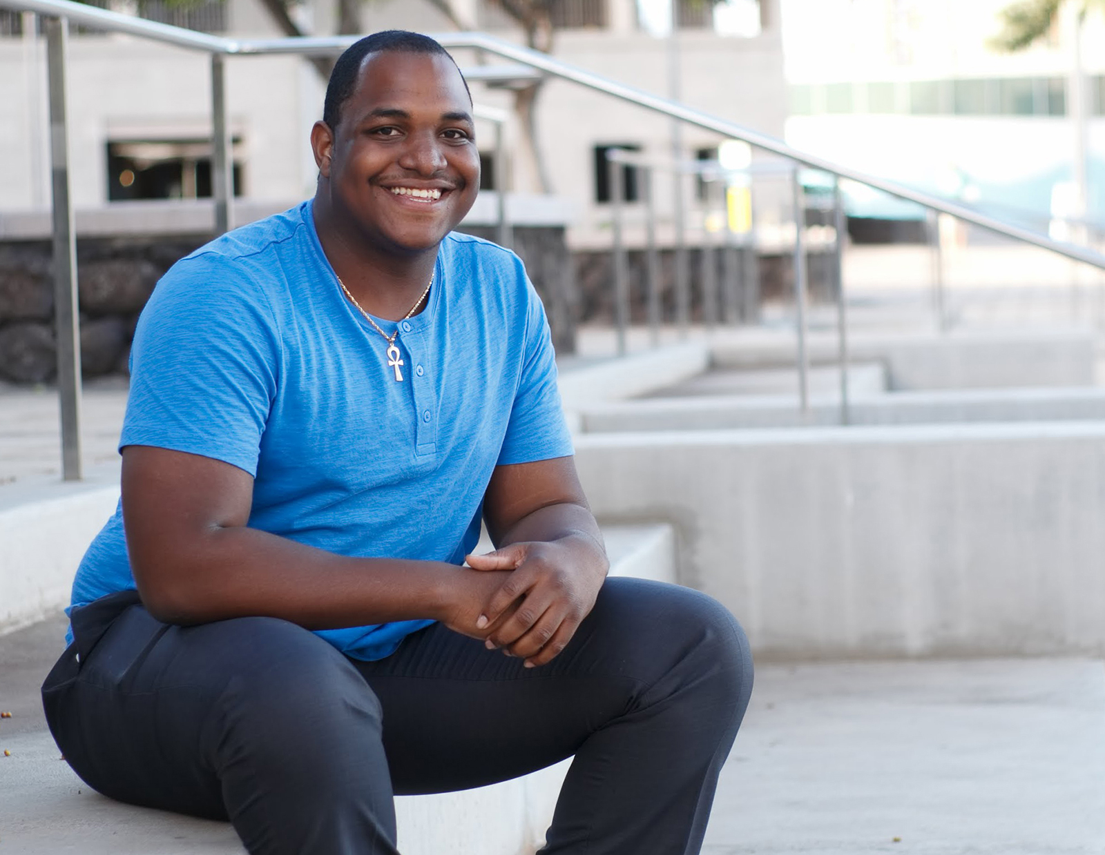 Student sitting and smiling.