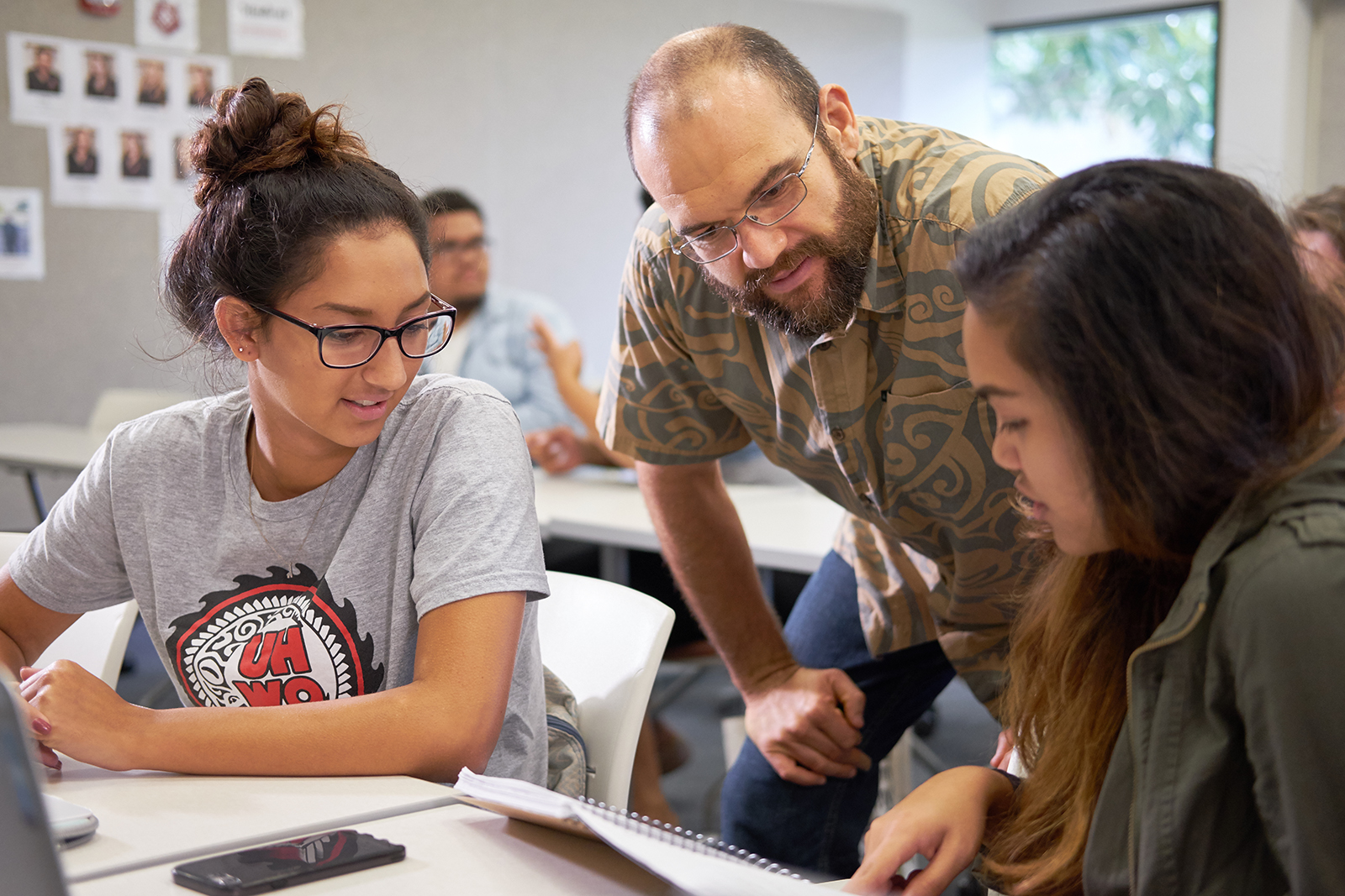 A professor and two students in a History class.