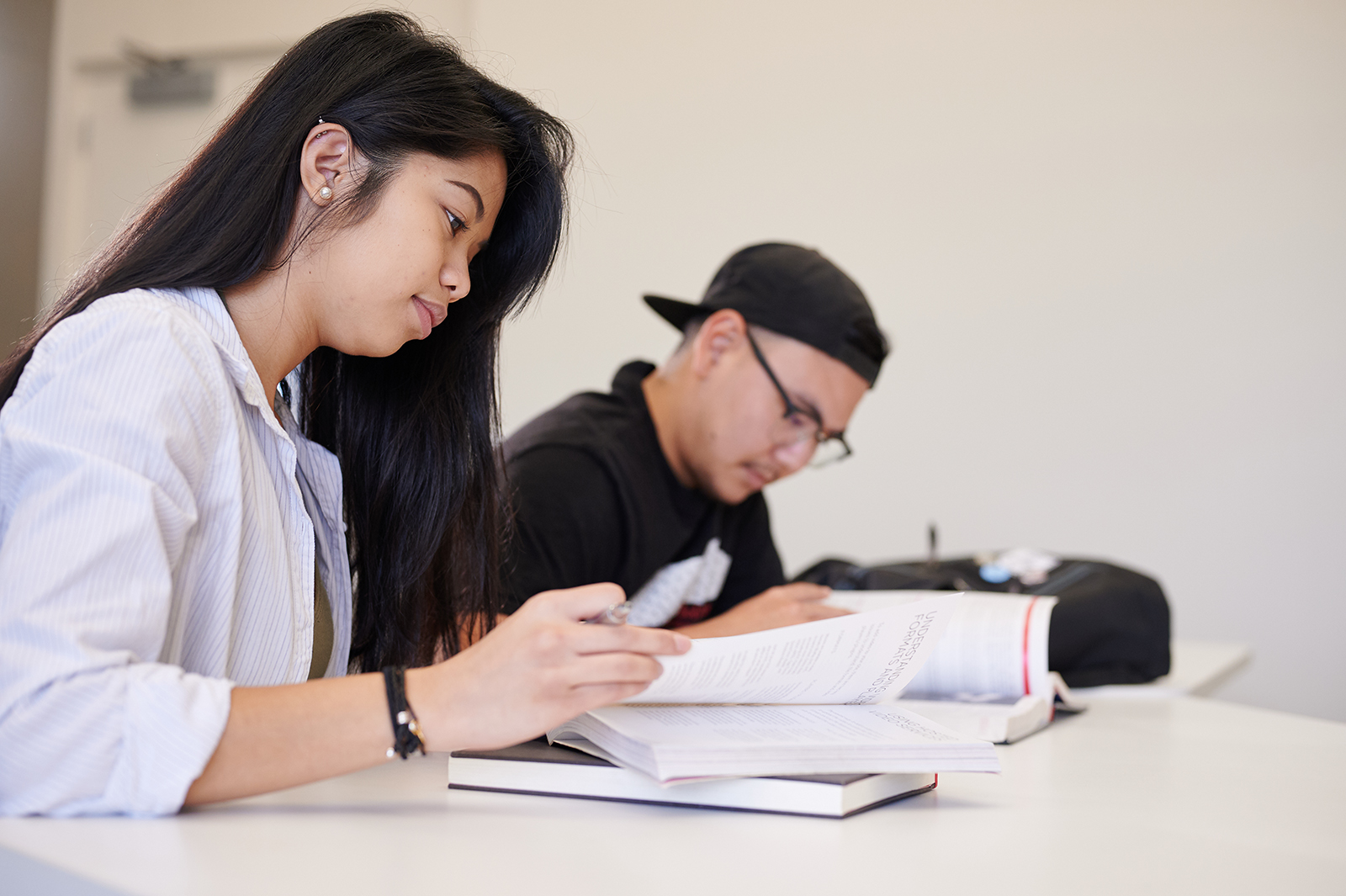 Two students studying in class.