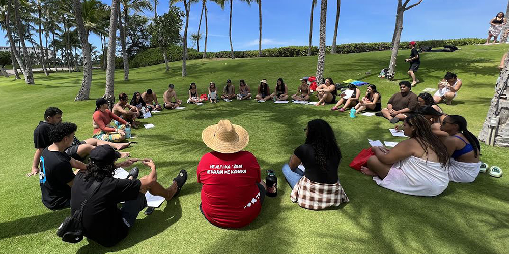 A group of student participants sitting in a circle for Ke Ala Kiakahi.